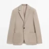 Blazer de lino de corte entallado con detalles en los bolsillos Blazer de lino de corte entallado con detalles en los bolsillos