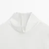 Blusa de cuello alto con detalle en el dobladillo Blusa de cuello alto con detalle en el dobladillo