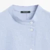 Blusa fluida con detalle de cuello abotonado Blusa fluida con detalle de cuello abotonado