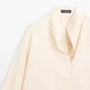 Blusa fluida con detalle de peto Blusa fluida con detalle de peto