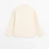 Blusa fluida con detalle de peto Blusa fluida con detalle de peto