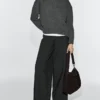 Bolso de piel de ante serraje con ojales Bolso de piel de ante serraje con ojales