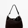 Bolso de piel de ante serraje con ojales Bolso de piel de ante serraje con ojales