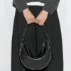 Bolso de piel napa con ojales Bolso de piel napa con ojales