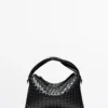 Bolso mediano de piel napa tejida Bolso mediano de piel napa tejida