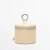 Bolso redondo de piel napa con pedrería Bolso redondo de piel napa con pedrería