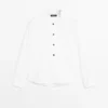 Camisa de cuello alto con botones dorados