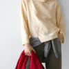 Camisas asimétricas con botones Camisas asimétricas con botones