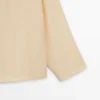 Camisas asimétricas con botones Camisas asimétricas con botones