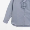 Camisas con detalle de cuello con volantes Camisas con detalle de cuello con volantes