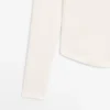 Camiseta de manga larga con dobladillo redondeado Camiseta de manga larga con dobladillo redondeado