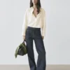 Jeans de talle alto con corte acampanado y bolsillos Jeans de talle alto con corte acampanado y bolsillos