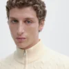 Jerséu de punto con cuello alto y cremallera Jerséu de punto con cuello alto y cremallera
