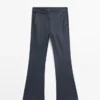 Pantalones acampanados encerados Pantalones acampanados encerados