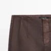 Pantalones acampanados encerados Pantalones acampanados encerados
