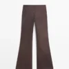 Pantalones acampanados encerados Pantalones acampanados encerados
