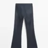 Pantalones acampanados encerados Pantalones acampanados encerados