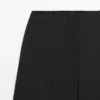 Pantalones cortos de pierna ancha de lana elástica Pantalones cortos de pierna ancha de lana elástica
