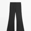Pantalones de corte acampanado a rayas Pantalones de corte acampanado a rayas