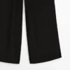 Pantalones de seda fluidos en contraste Pantalones de seda fluidos en contraste