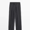 Pantalones plisados de pierna ancha y voluminosa Pantalones plisados de pierna ancha y voluminosa