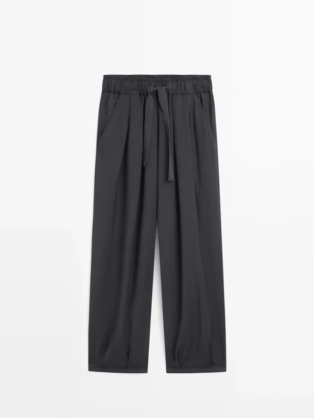 Pantalones plisados de pierna ancha y voluminosa Pantalones plisados de pierna ancha y voluminosa