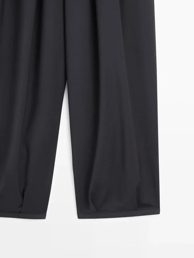 Pantalones plisados de pierna ancha y voluminosa Pantalones plisados de pierna ancha y voluminosa