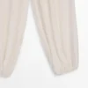 Pantalones sarouel fluidos con detalle plisado Pantalones sarouel fluidos con detalle plisado