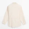 Sobrecamiseta fluida con detalle de cuello Sobrecamiseta fluida con detalle de cuello