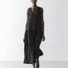 Vestido midi plisado y fluido Vestido midi plisado y fluido