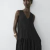 Vestido midi plisado y fluido Vestido midi plisado y fluido