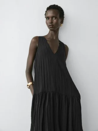 Vestido midi plisado y fluido