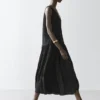 Vestido midi plisado y fluido Vestido midi plisado y fluido