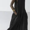 Vestido midi plisado y fluido Vestido midi plisado y fluido